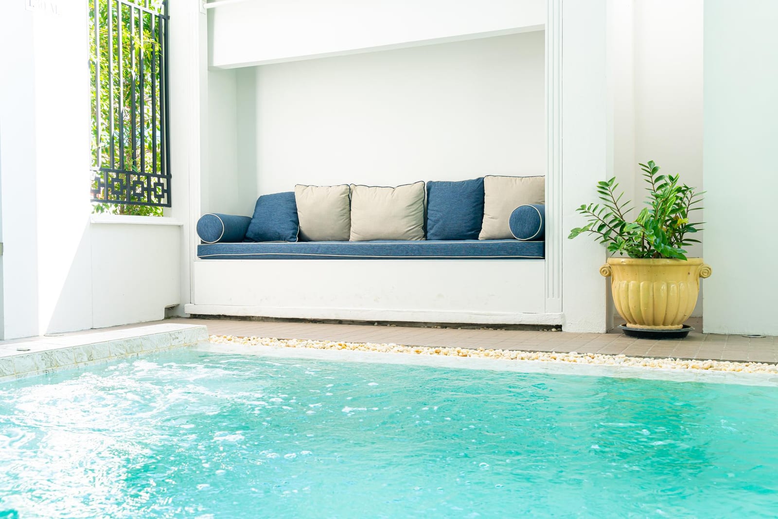 Pool service technician communicating with a Houston homeowner about route service — clear client communication is a competitive differentiator in crowded markets